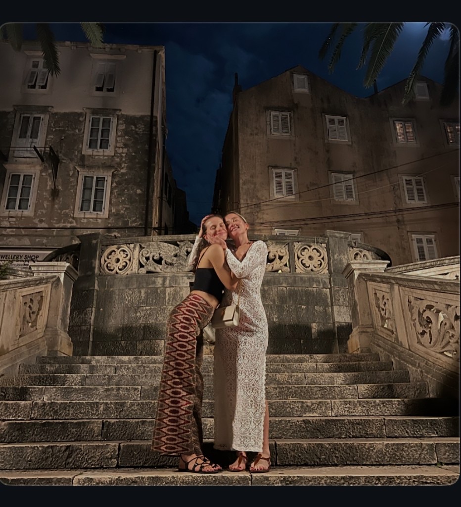Velvet Ties members together on stone steps at night