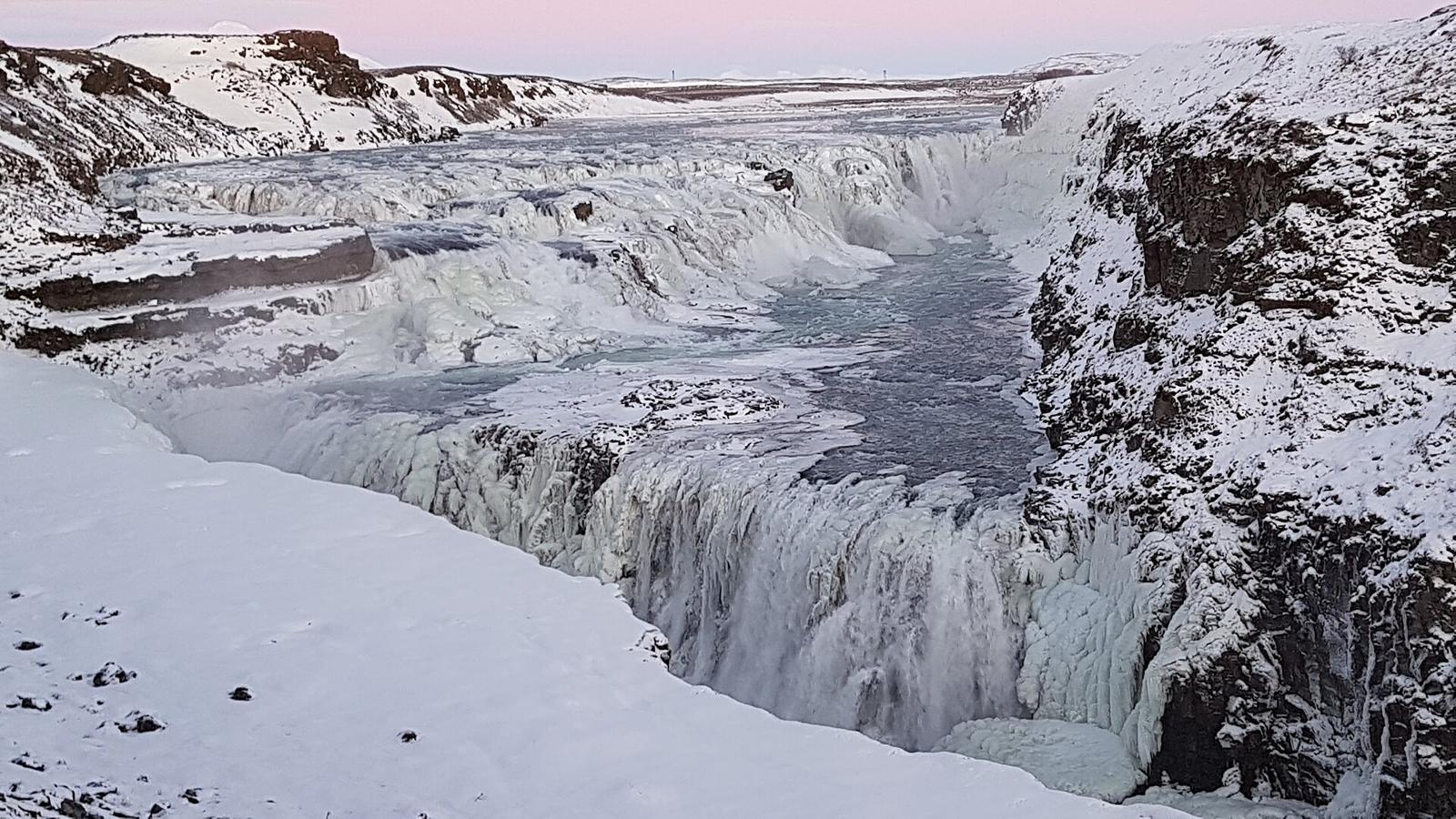 Gullfoss waterfall in winter, half frozen